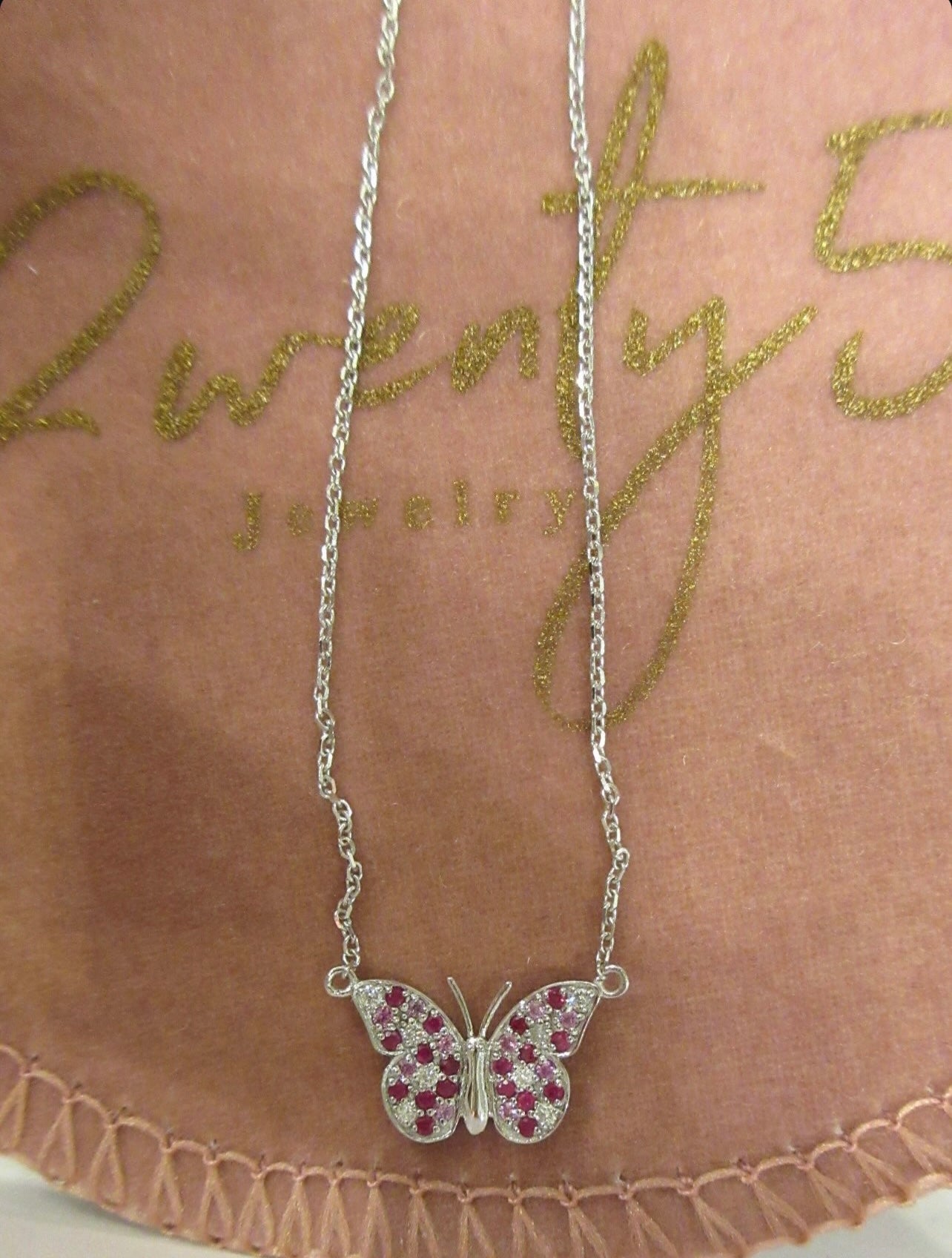 By2wenty5 Large Butterfly Necklace displayed on a jewellery pouch