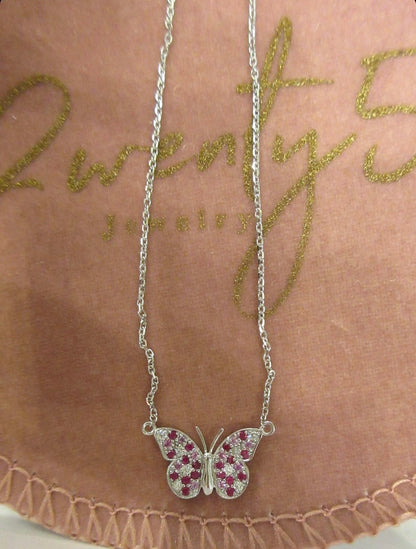By2wenty5 Large Butterfly Necklace displayed on a jewellery pouch