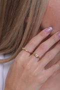 Classiyah Radiance Solitaire Ring in 18K gold, worn on the hand