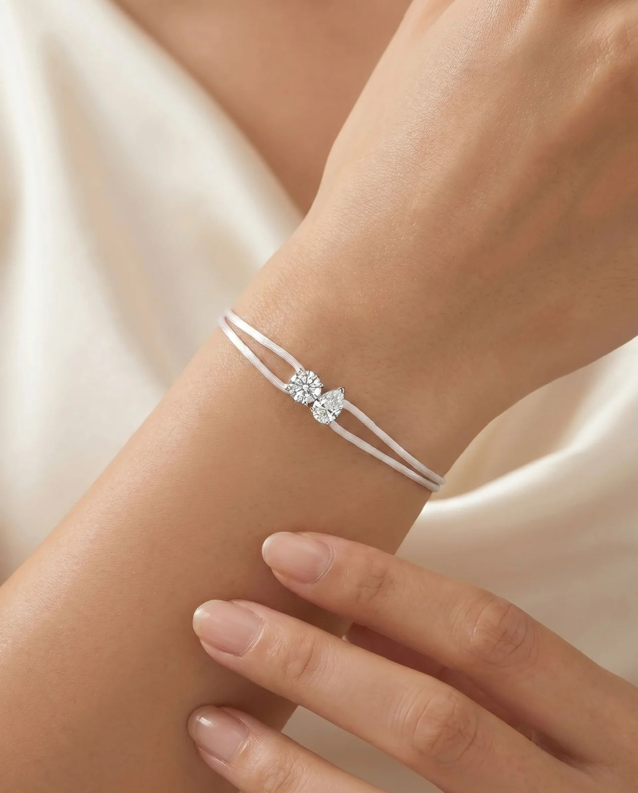 Satin Cord Bracelet Double Pear in white, worn on wrist