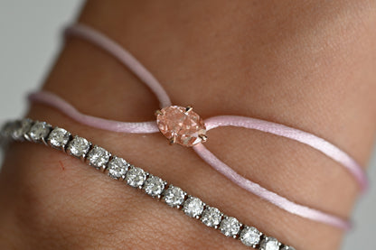 Dennis Luxe Satin Cord Bracelet in pink, stacked with a tennis bracelet
