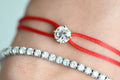 Dennis Luxe Satin Cord Bracelet in red, stacked with a tennis bracelet