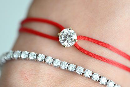 Dennis Luxe Satin Cord Bracelet in red, stacked with a tennis bracelet