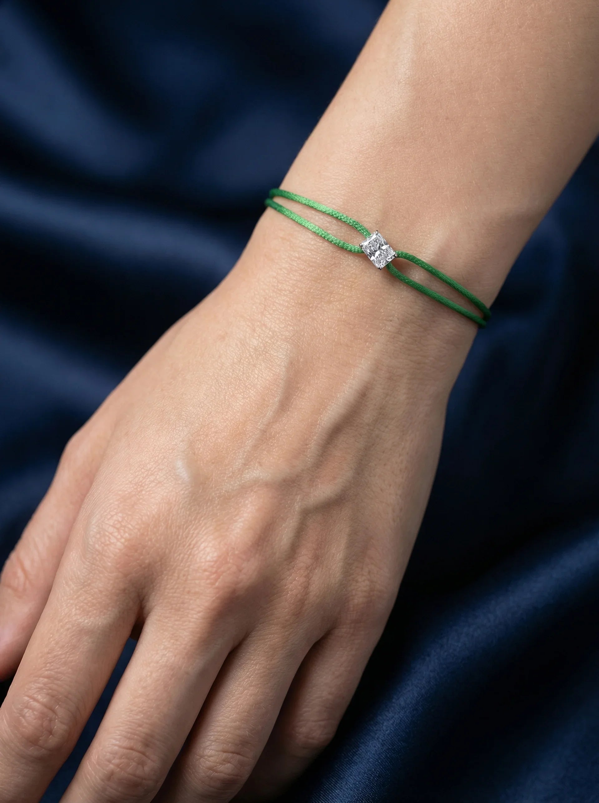 Dennis Luxe green satin cord bracelet, model lifestyle view