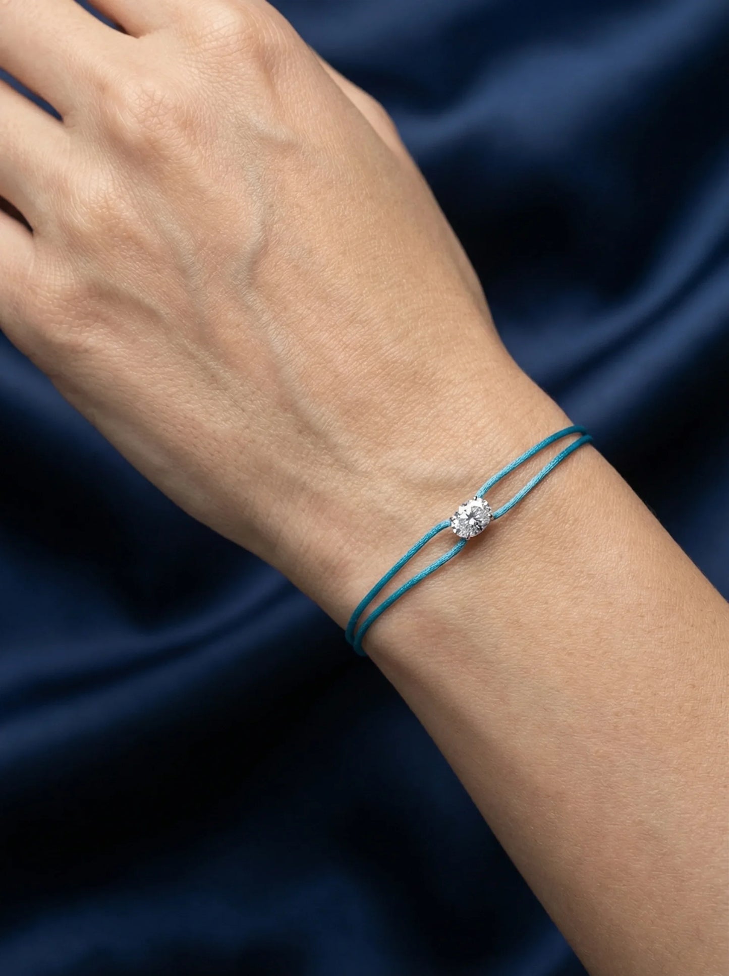 Dennis Luxe blue satin cord bracelet, model lifestyle view