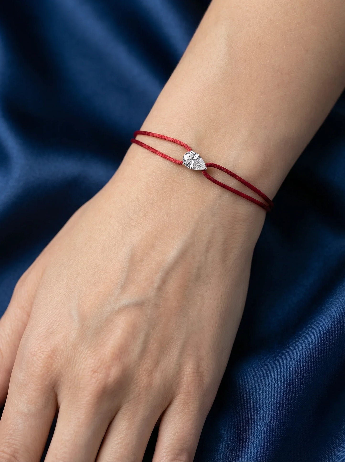 Dennis Luxe red satin cord bracelet, model lifestyle view