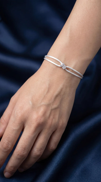 Dennis Luxe white satin cord bracelet, model lifestyle view