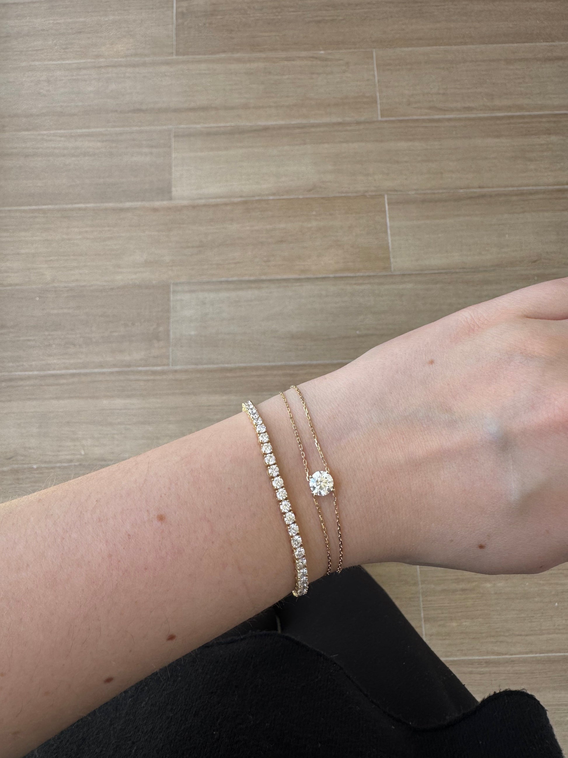 Dennis Luxe One Carat Bracelet stacked with a tennis bracelet on wrist