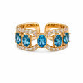 DTopaz Blue Topaz Diamond Ring in 18K gold on a white background