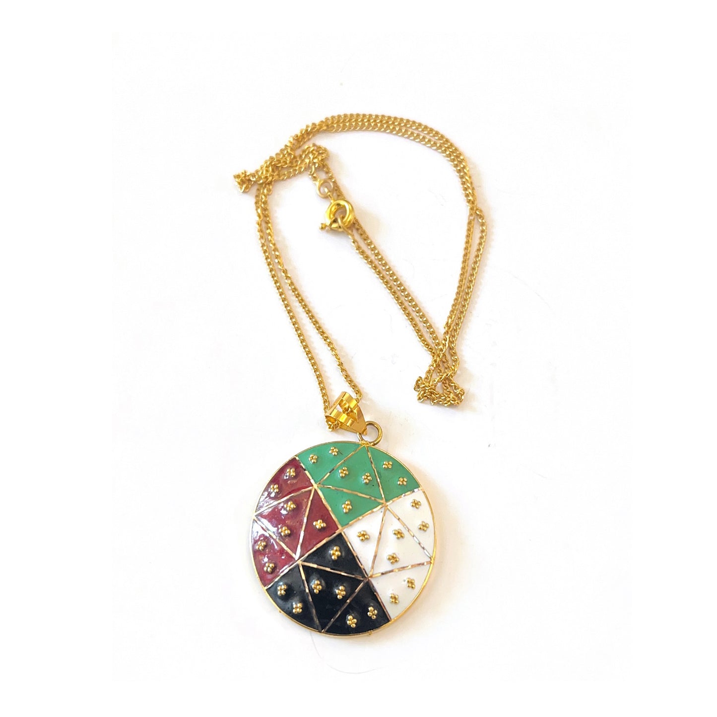 Gold necklace with a colorful pendant on a white background