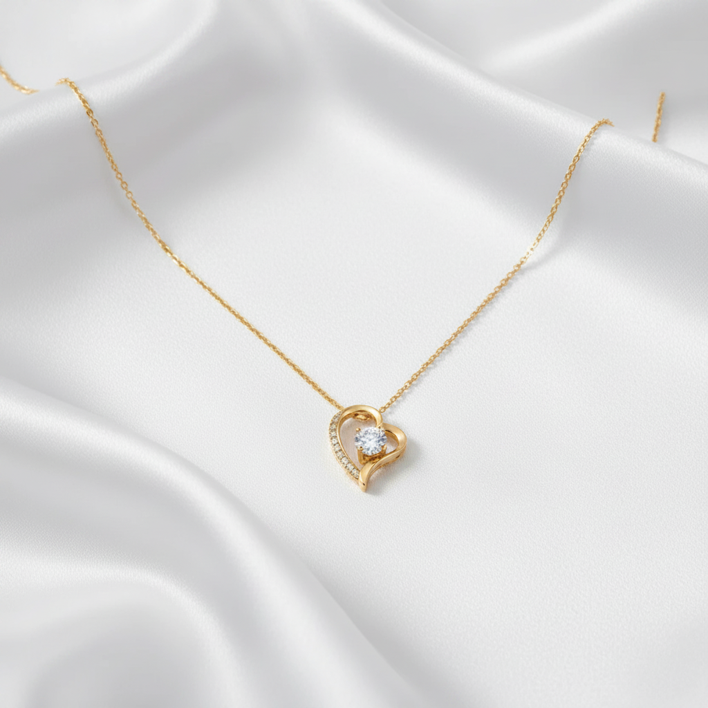 Eternal Heart Pendant in yellow gold, styled on white satin