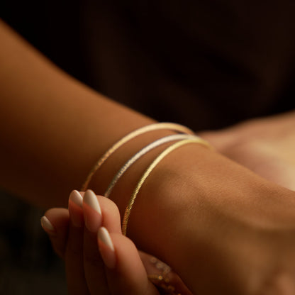 Gaia Gold Stackables Tri-Color Bracelets in 18K gold worn on wrist