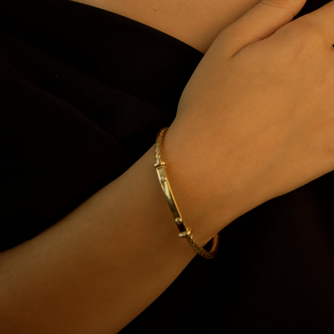 Gaia Gold Waiola Round Bracelet in 18K yellow gold worn on wrist