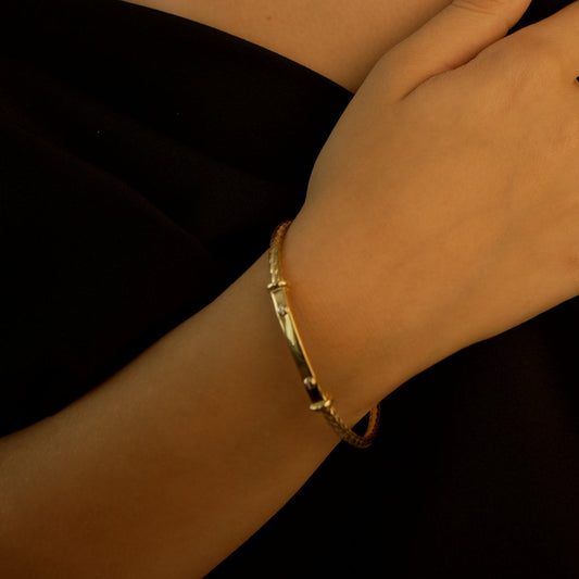 Gaia Gold Waiola Round Bracelet in 18K yellow gold worn on wrist