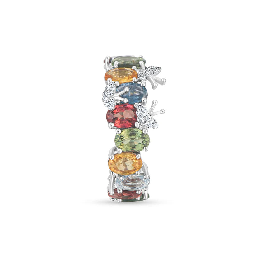 Multicolored gemstone ring with diamond accents on a white background