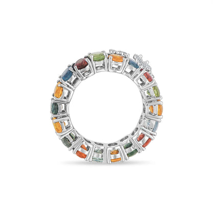 White gold ring with multicolored gemstones on a white background