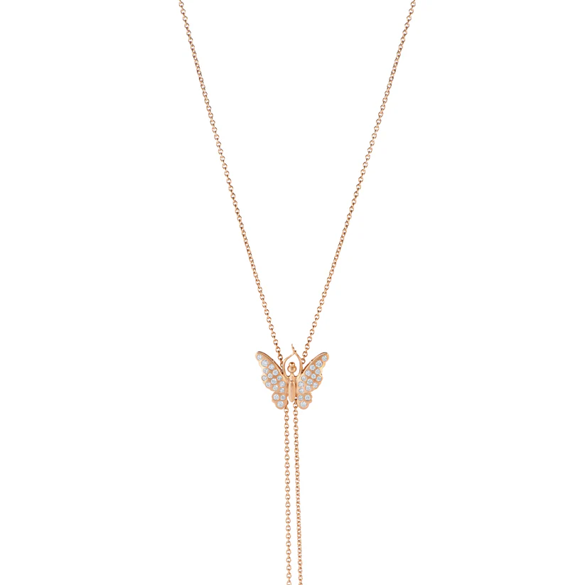 Butterfly-shaped pendant on a rose gold chain against a white background