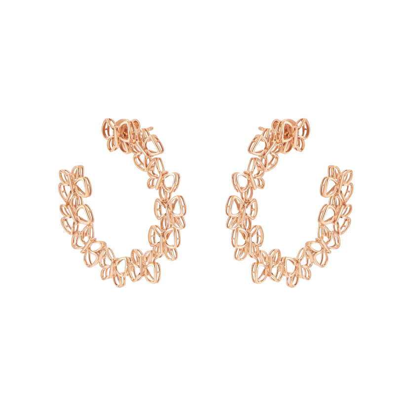 Rose gold hoop earrings on a white background