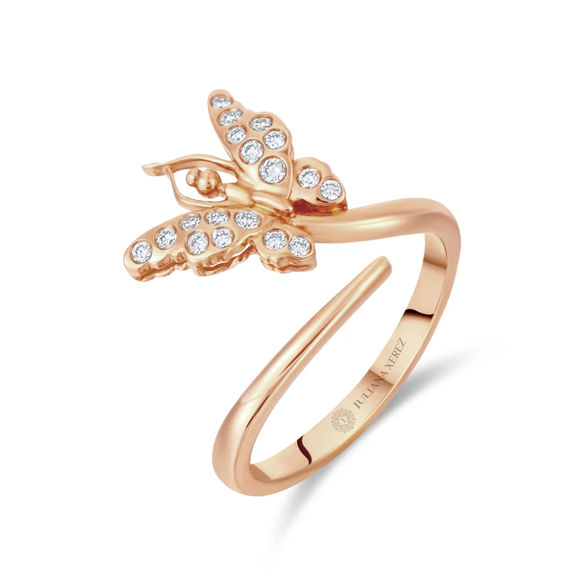 Rose gold butterfly ring with diamond accents on a white background