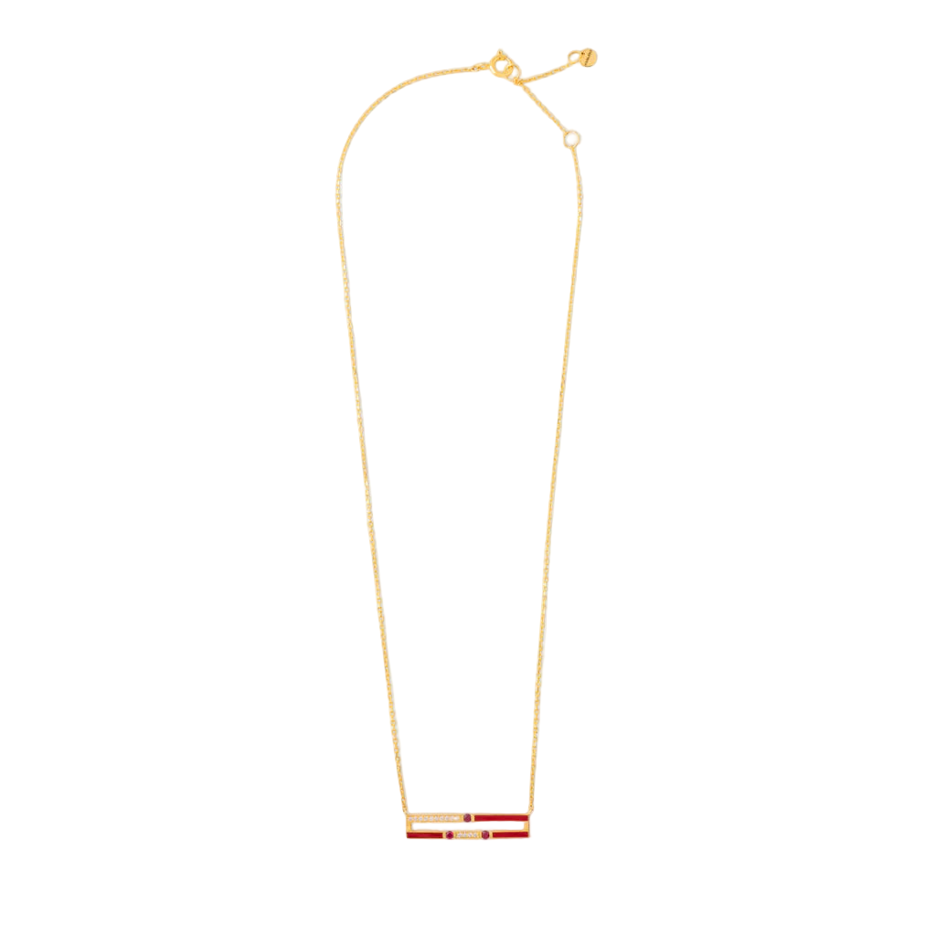 Gold necklace with a red and gold pendant on a white background
