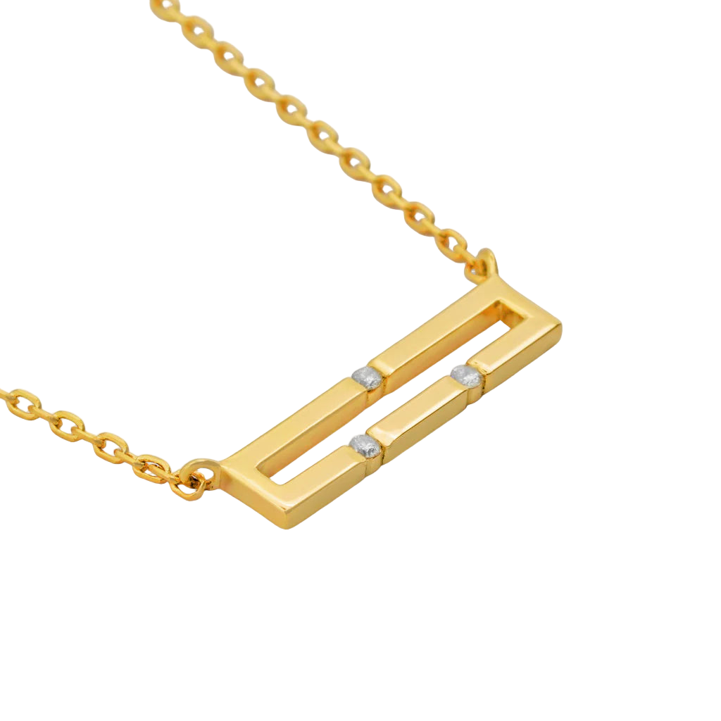 Gold necklace with a rectangular pendant on a white background
