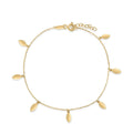 Gold bracelet with leaf-shaped charms on a white background