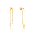 Gold earrings with chain and teardrop designs on a white background