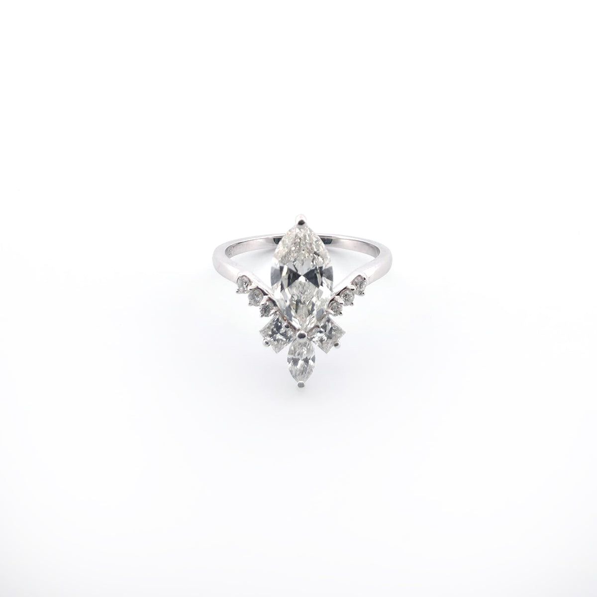 White gold ring with a marquise-shaped diamond on a white background
