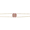 Gold necklace with a red and white square design on a white background