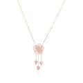 Necklace with a pink floral pendant on a white background