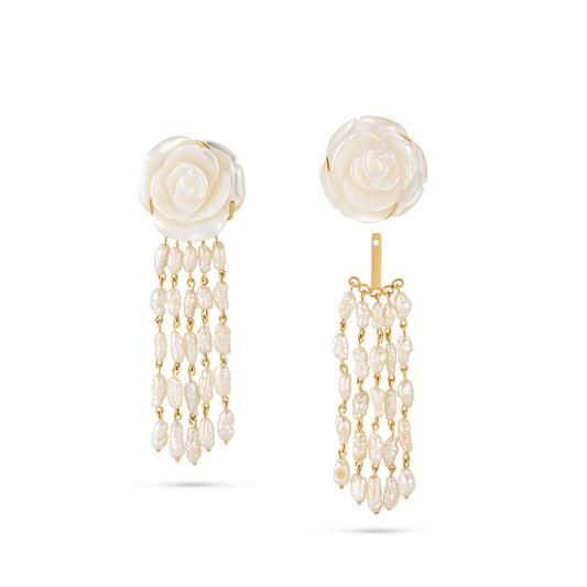 Pair of earrings with rose-shaped tops and pearl drop elements on a white background
