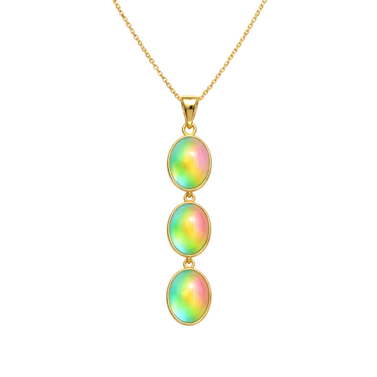 Gold necklace with three colorful oval stones on a white background