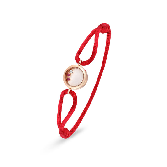 18k rose gold cuff bracelet with orbiting diamond and gemstone detail, red cord