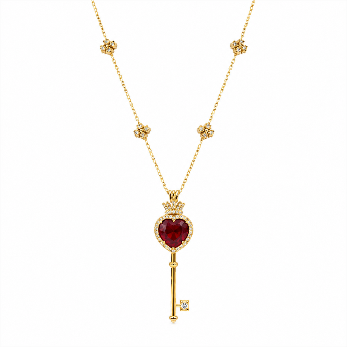 18k gold key-shaped necklace with ruby