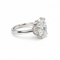 18K white gold Nova Ring with oval-cut lab-grown centre diamond and half-moon side stones on a white background