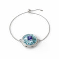 18k white gold bracelet with tanzanite, diamond halo, and sky blue enamel