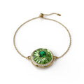 18k gold bracelet with verdelite, diamond halo, and green enamel