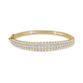 White Drop Dune Three Row Bangle in 18K yellow gold on a white background