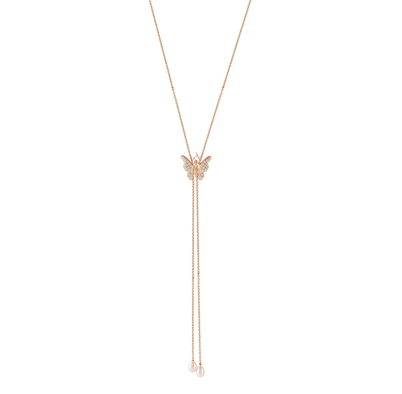 Rose gold butterfly necklace on a white background