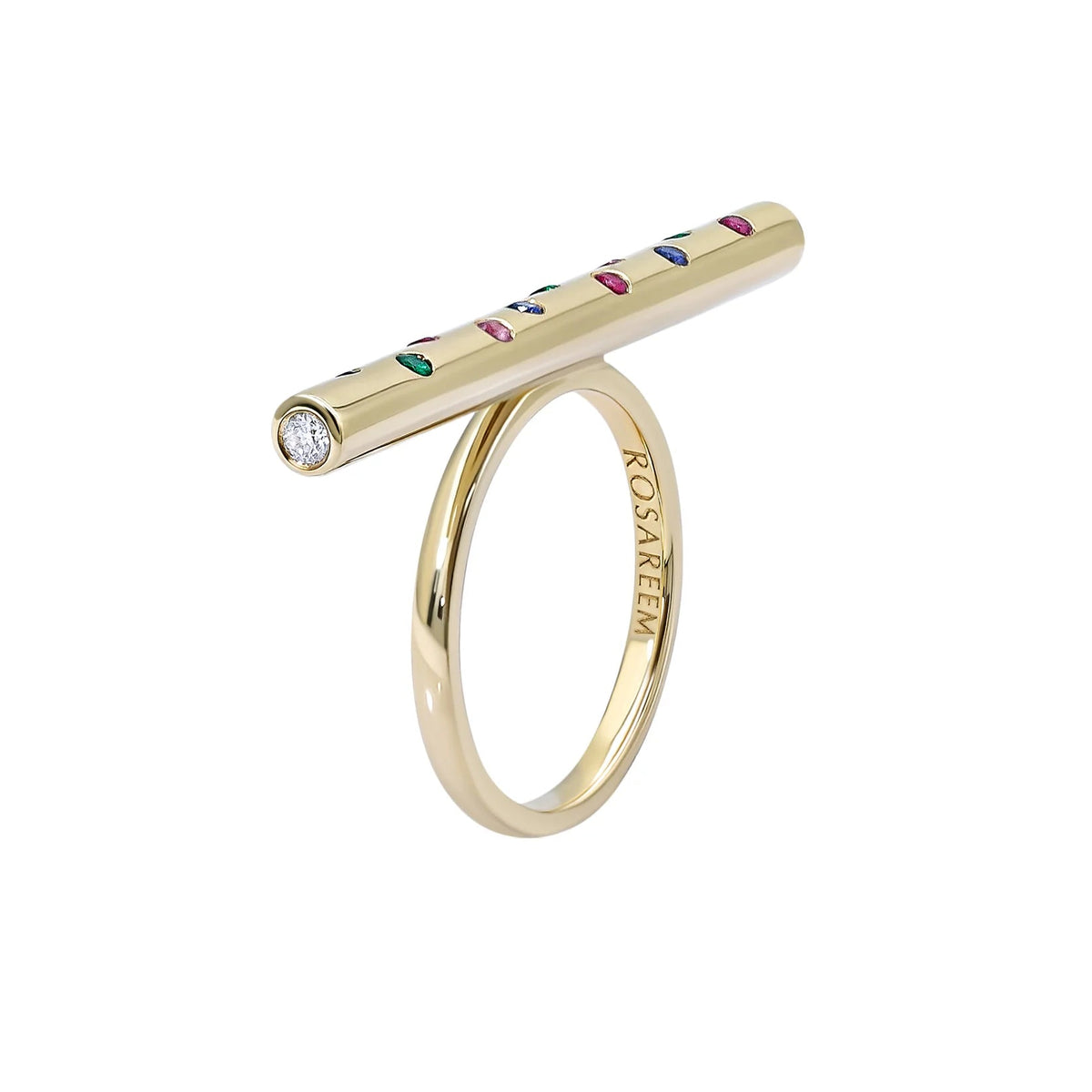 Gold ring with a colorful gemstone set on a white background