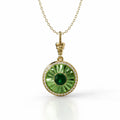 18k yellow gold pendant with verdelite, diamond halo, and green enamel