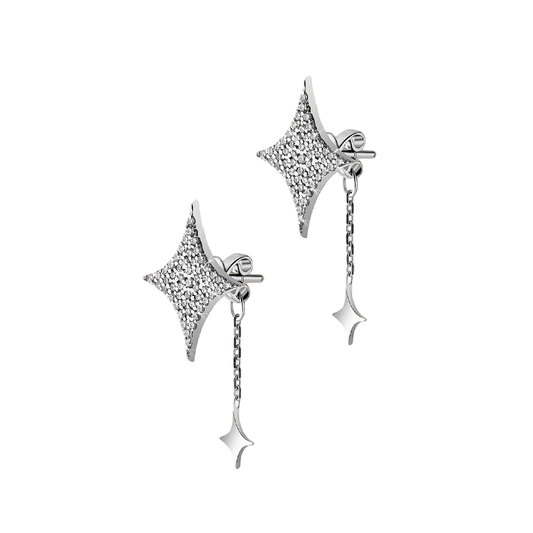 Star-shaped silver earrings with dangling elements on a beige background