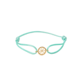 Turquoise bracelet with a gold charm on a white background