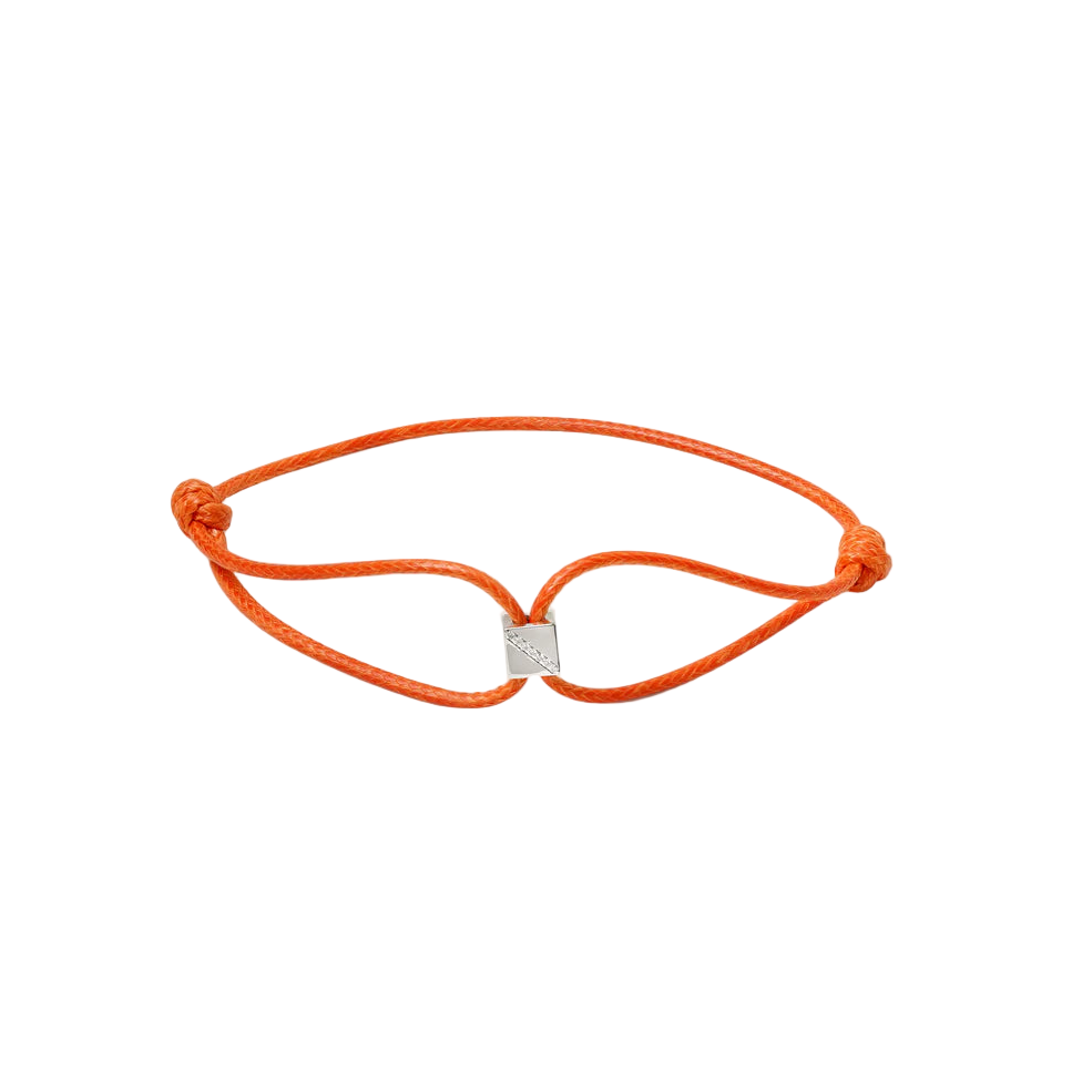 Orange bracelet with a gold clasp on a white background