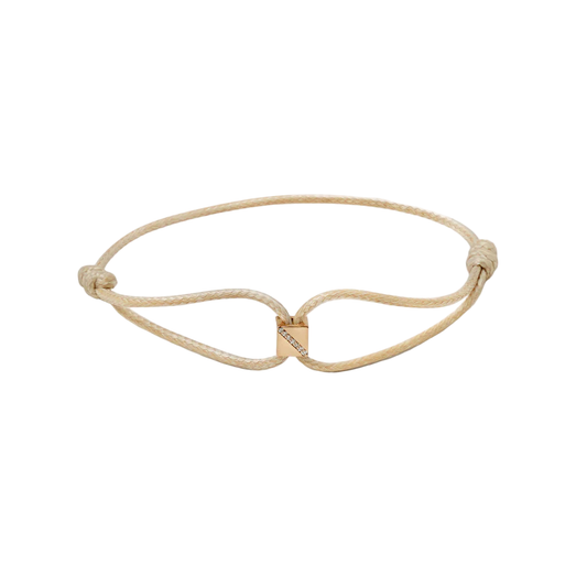 Gold bracelet with a unique design on a white background