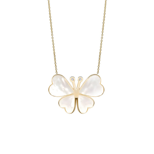 Butterfly-shaped pendant necklace with gold frame and white stones on a white background
