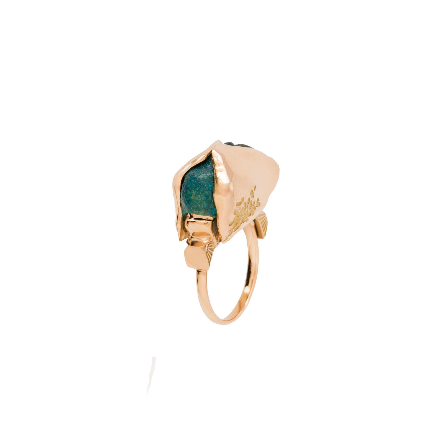 Gold ring with green gemstone on a white background