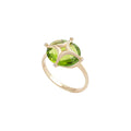 Nur Tesra Peridot Ring in 18k yellow gold on white background