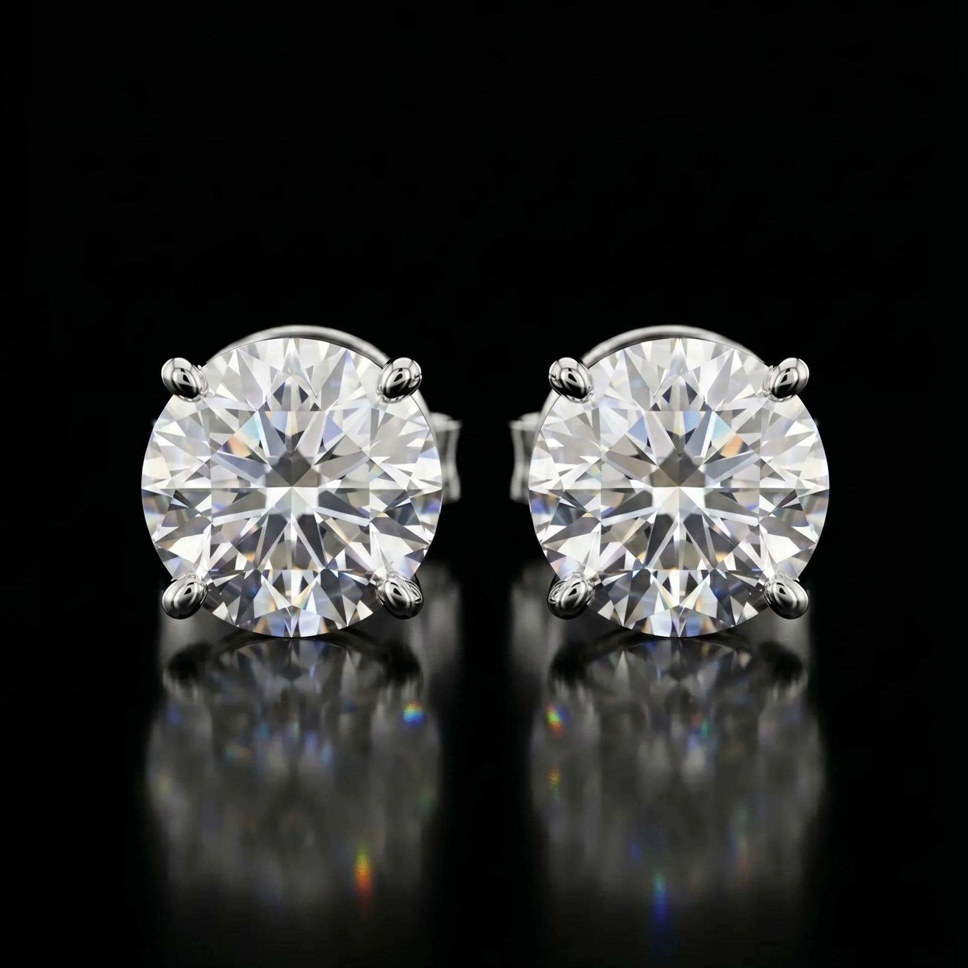 Pair of diamond stud earrings on a black background
