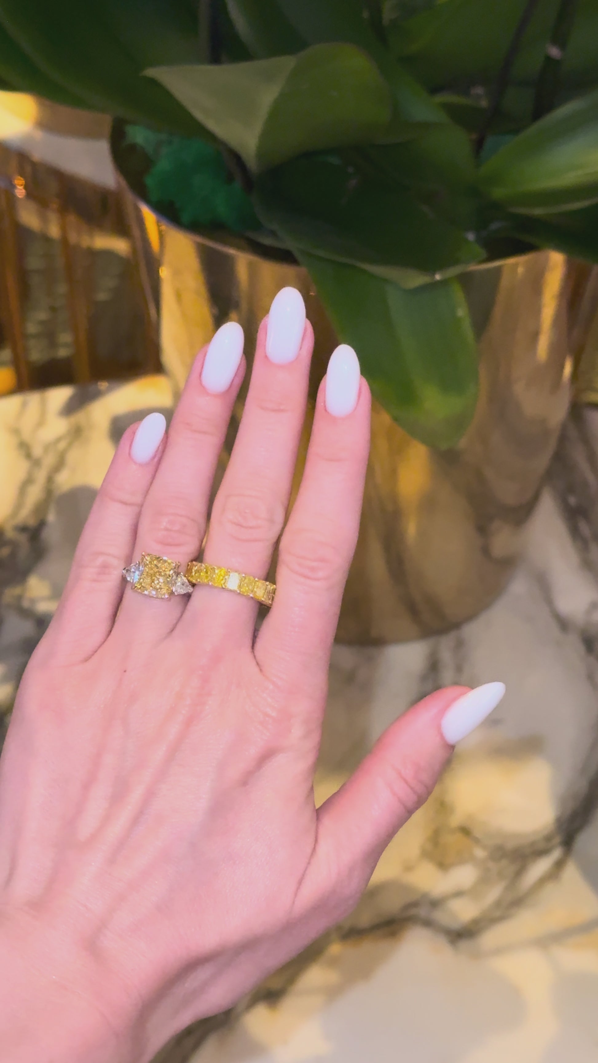 Verbesa Atelier Fancy Yellow eternity ring worn with cushion diamond ring